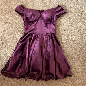 Purple off the shoulder dress.